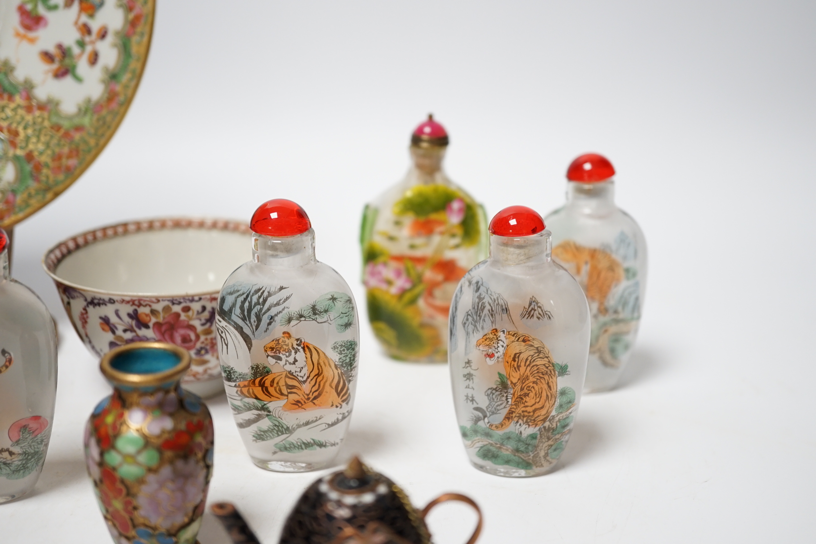 A collection of mixed Chinese scent bottles a famille rose plate and two tea bowls together with various Japanese items